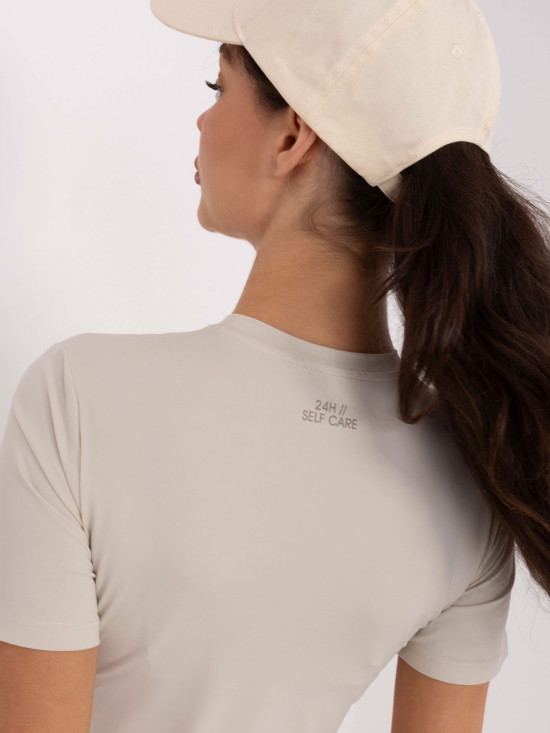 Beigefarbene glatte Bluse mit kurzem Ärmel