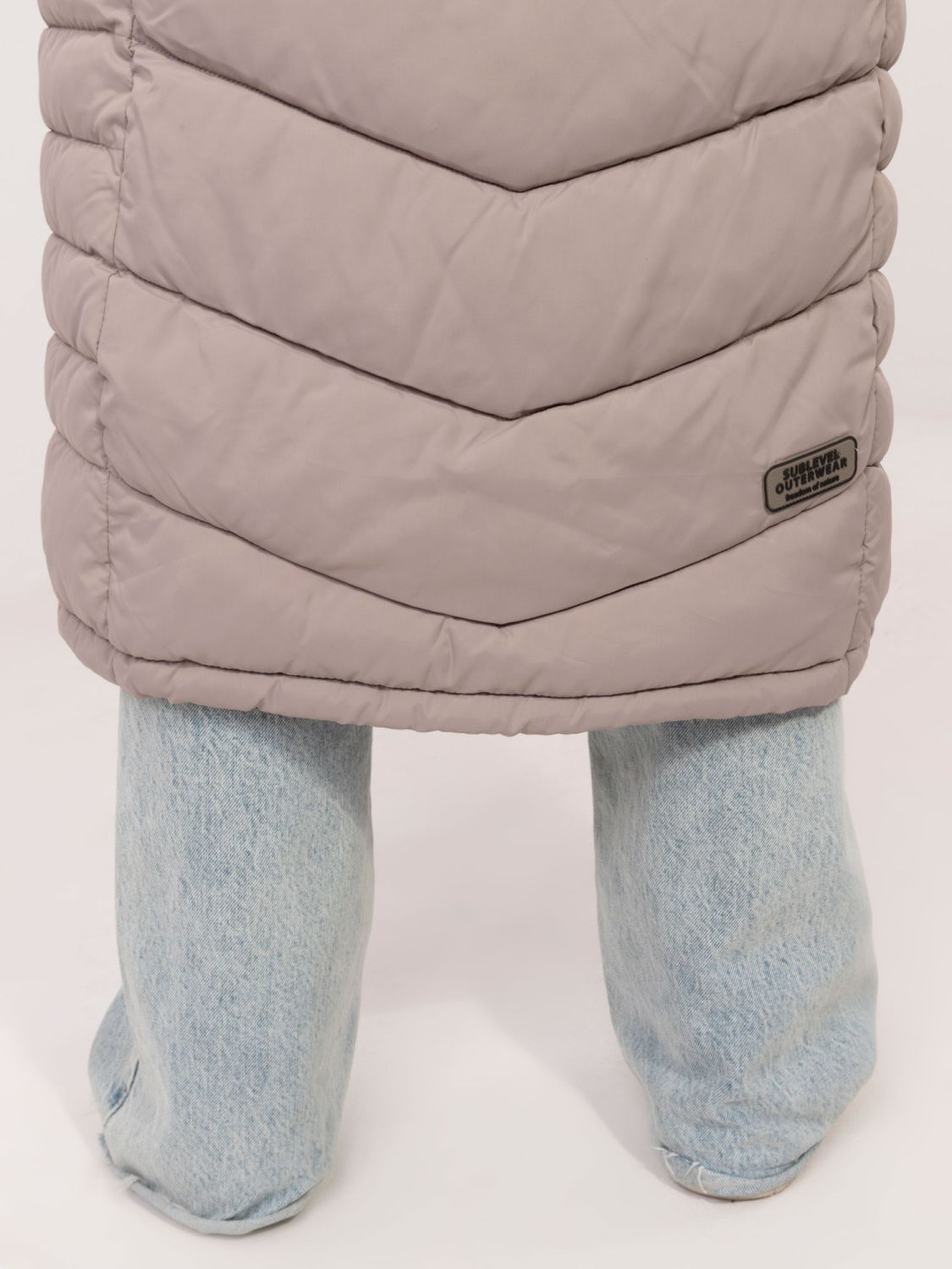 Langer beiger Mantel mit Futter