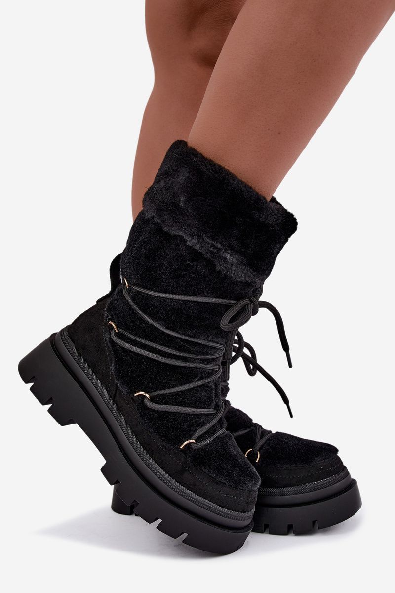 Schwarze Schneestiefel mit Fellbesatz und Plateausohle
