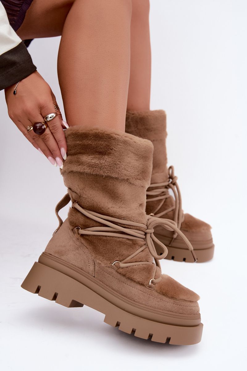 Beige Schneestiefel mit Fellbesatz auf Plateausohle