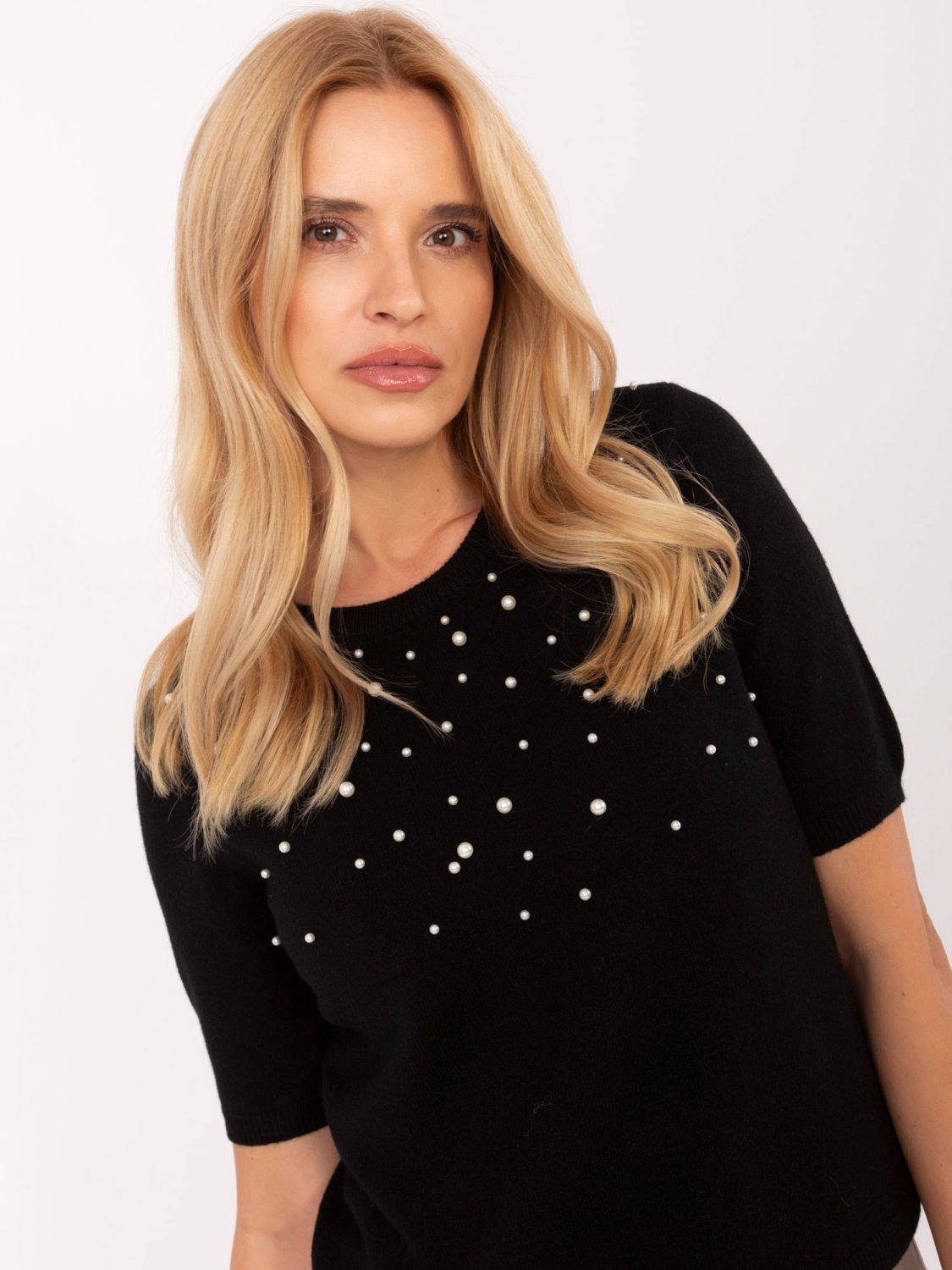 Eleganter schwarzer Pullover mit Applikation