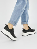 Damen schwarze Sneakers mit dicker Sohle