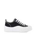 Schwarz-weiße Sneakers mit dicker Sohle